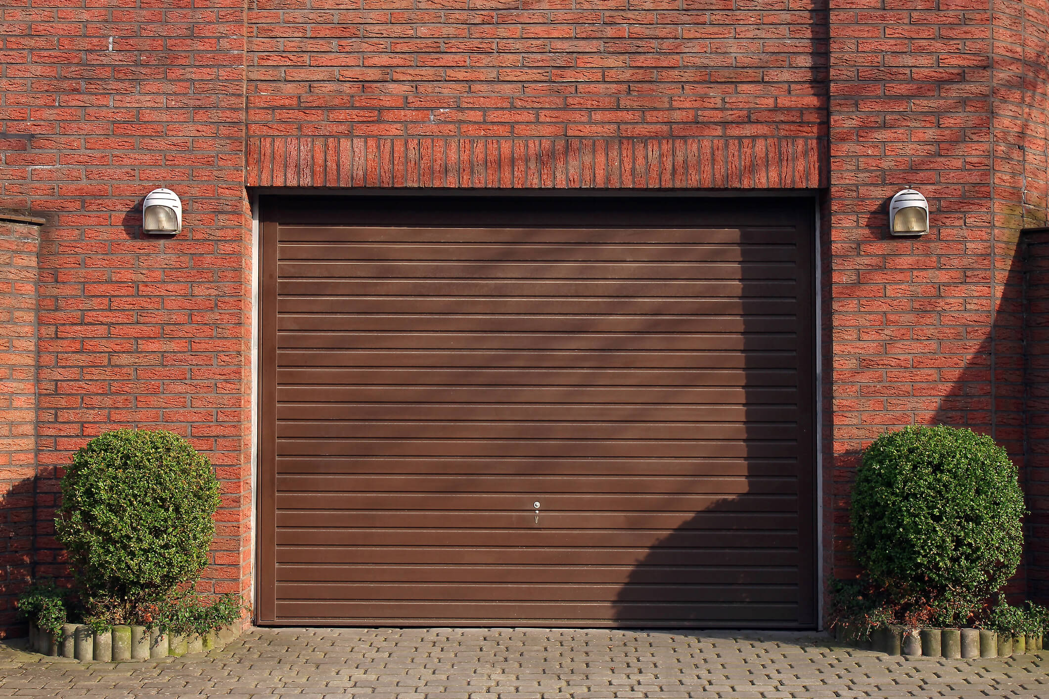 Garage door in brick wall